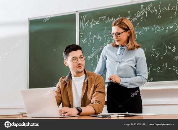 Teacher smiling at students