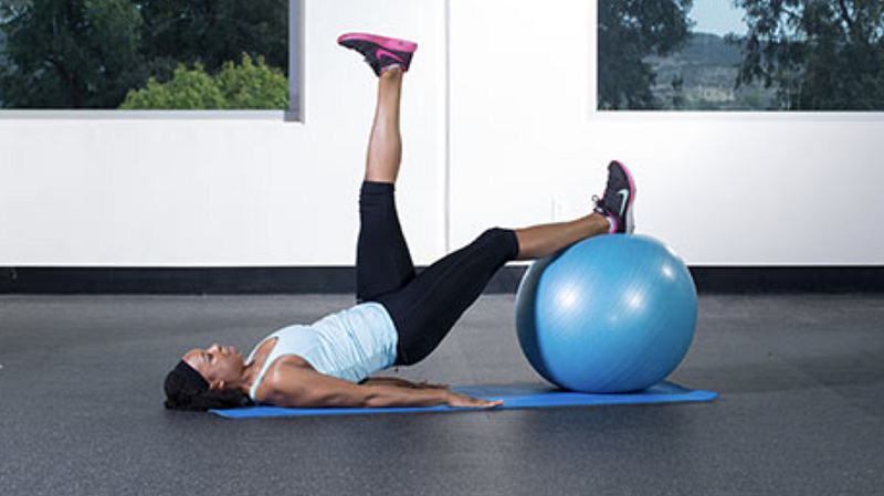 Demonstration of single-leg hamstring curl exercise