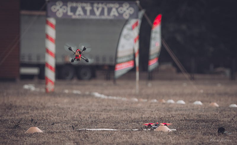 Drone racing pilots demonstrating their skills